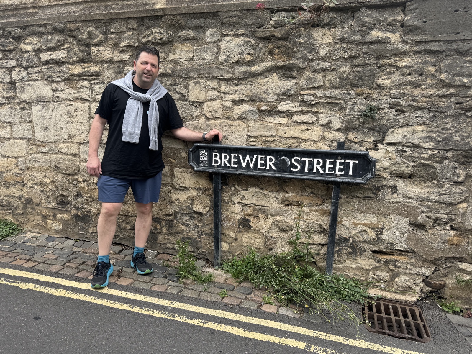 Derek standing beside the Brewer Street sign in Oxford