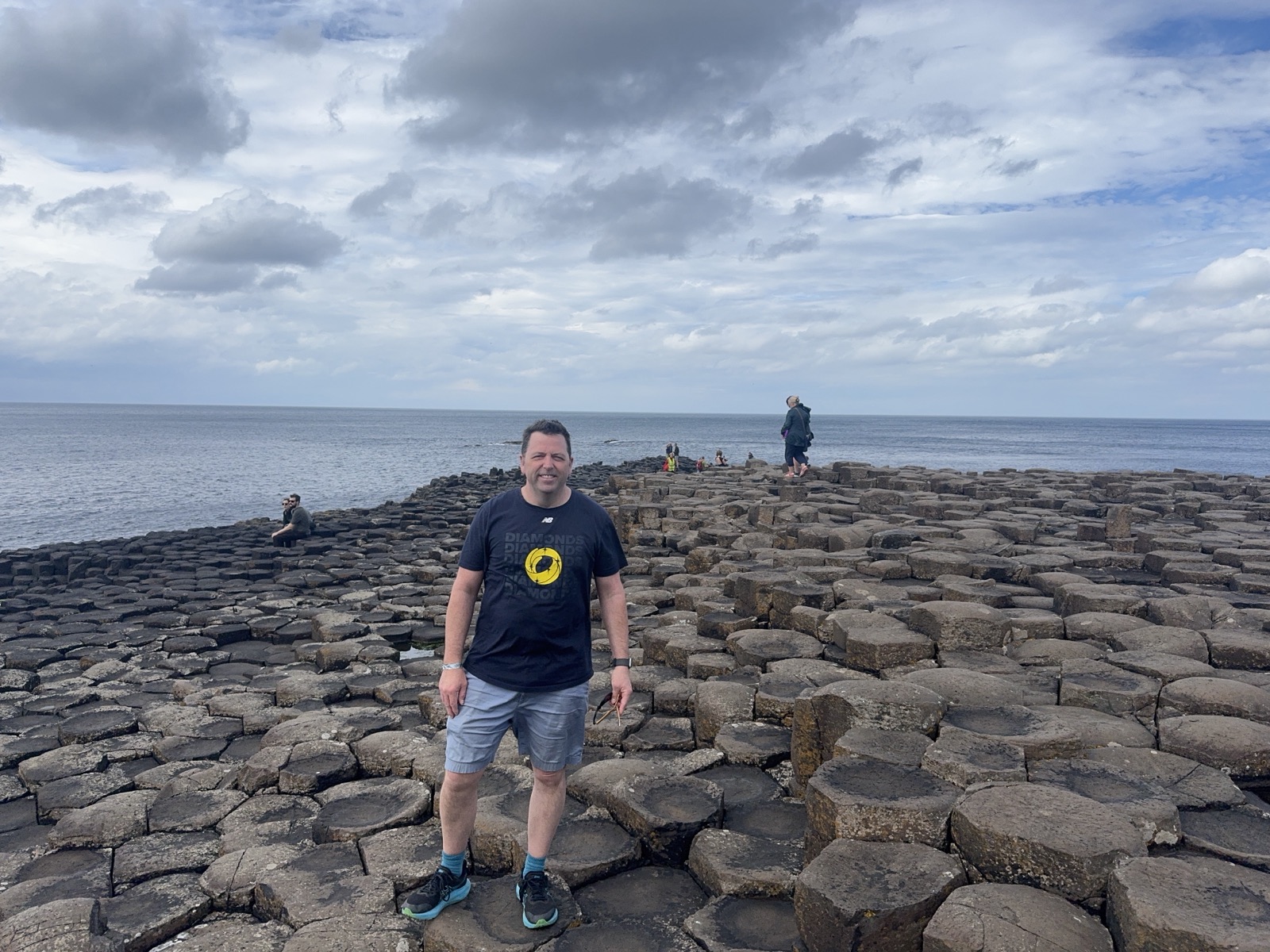 Derek standing on the stones at the Giant's Causeway