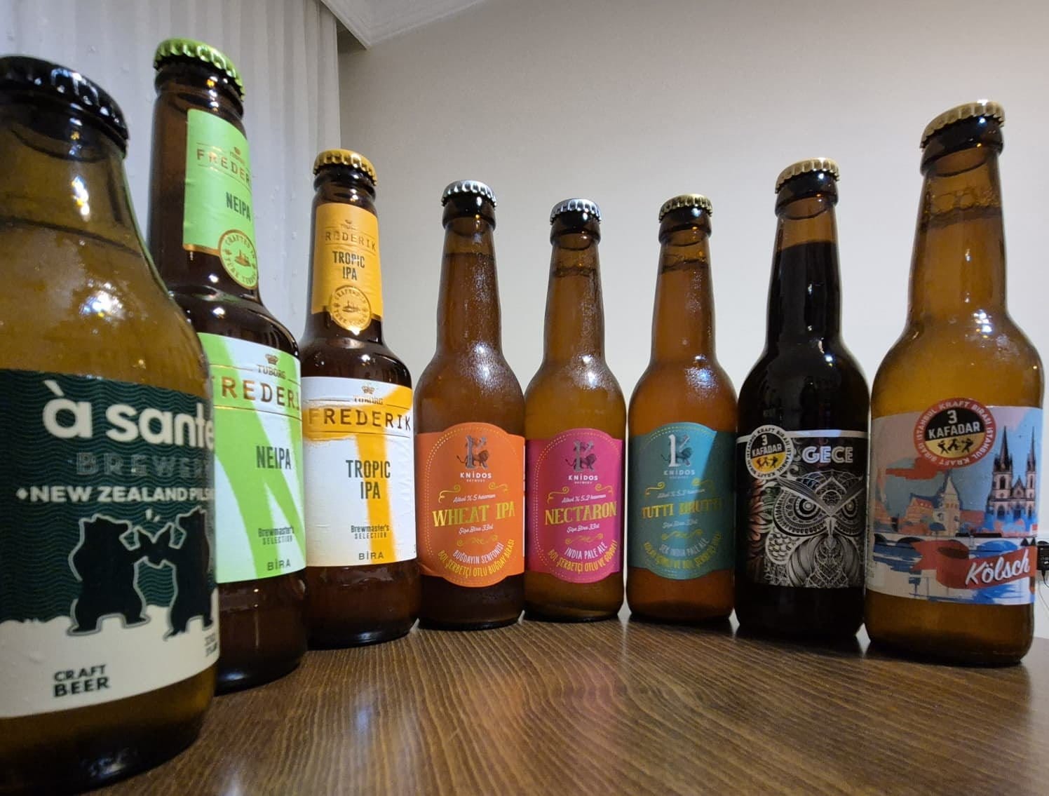 A row of Turkish craft beer bottles Yusuf brought home from Turkey