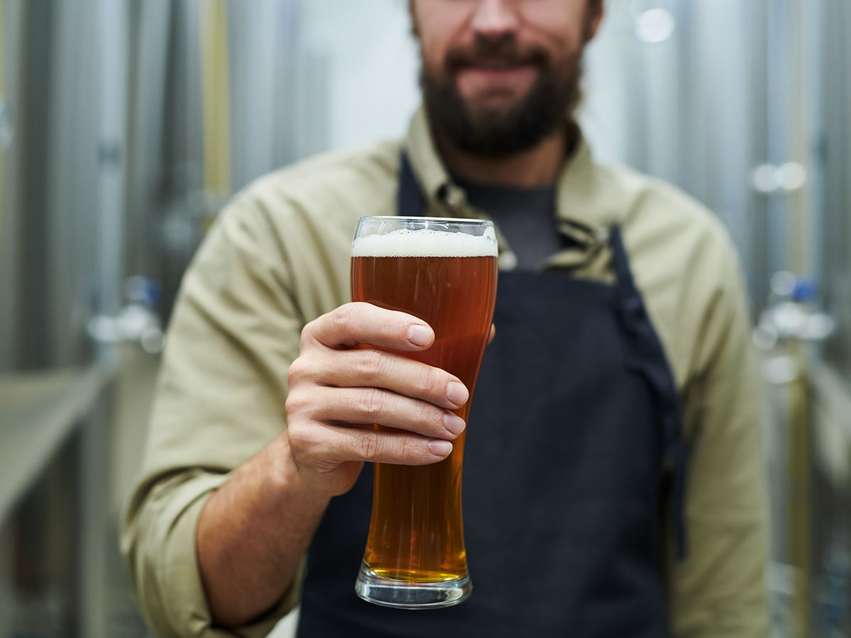 Man holding glass of beer